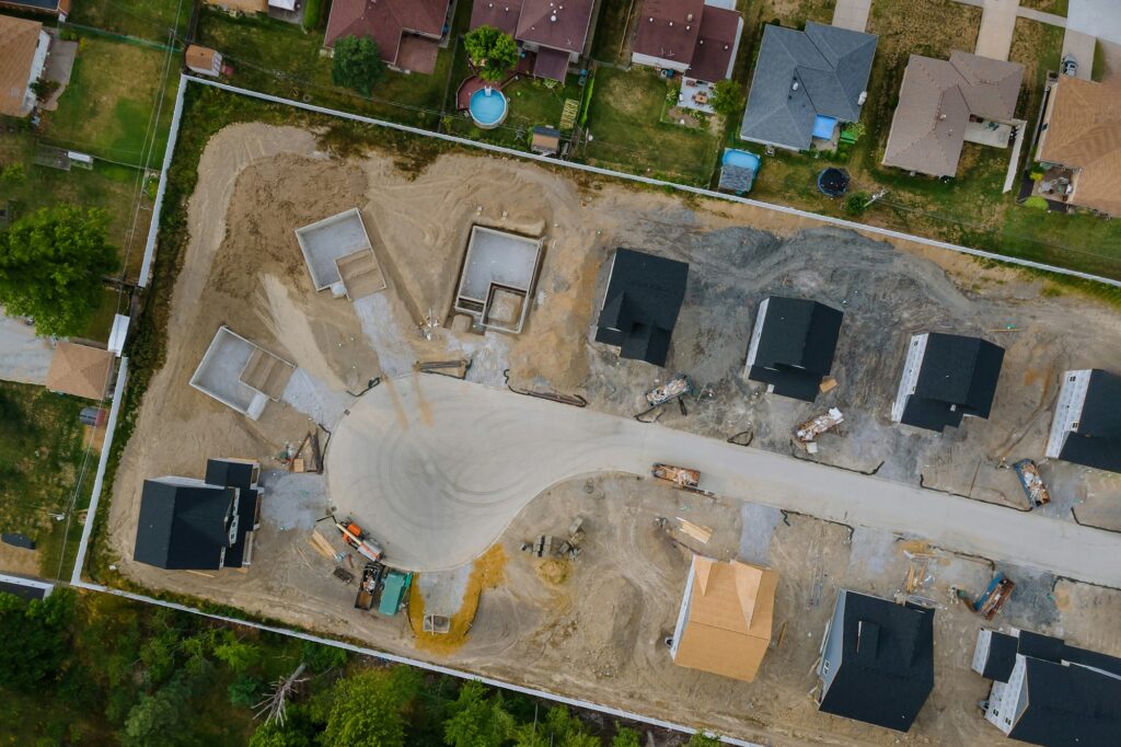 A residential aerial view of new housing development being built of a new home under construction